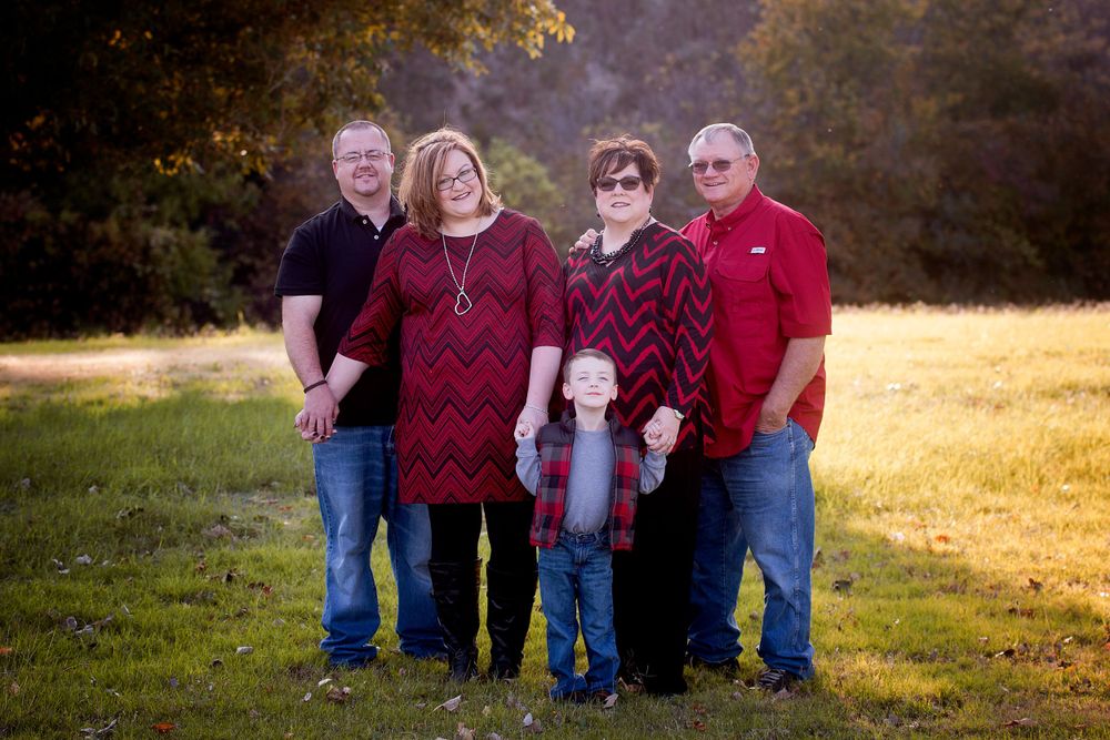 mom and dad with adult daughter, son in law and grandson