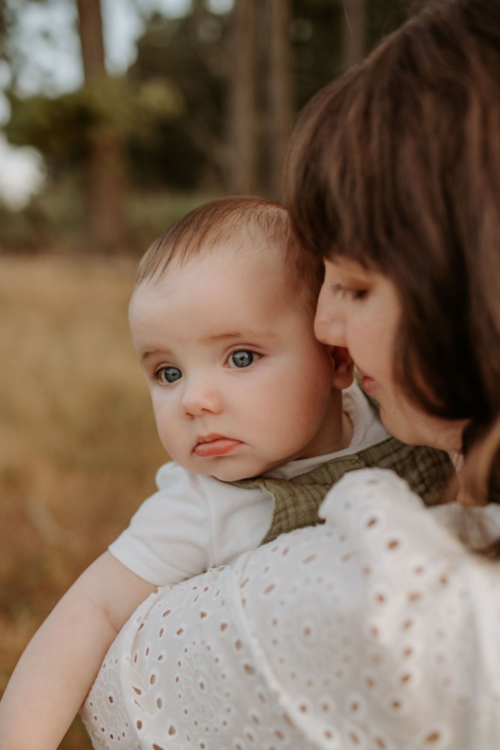 Adelaide family photographer - mother cuddling son at sunset