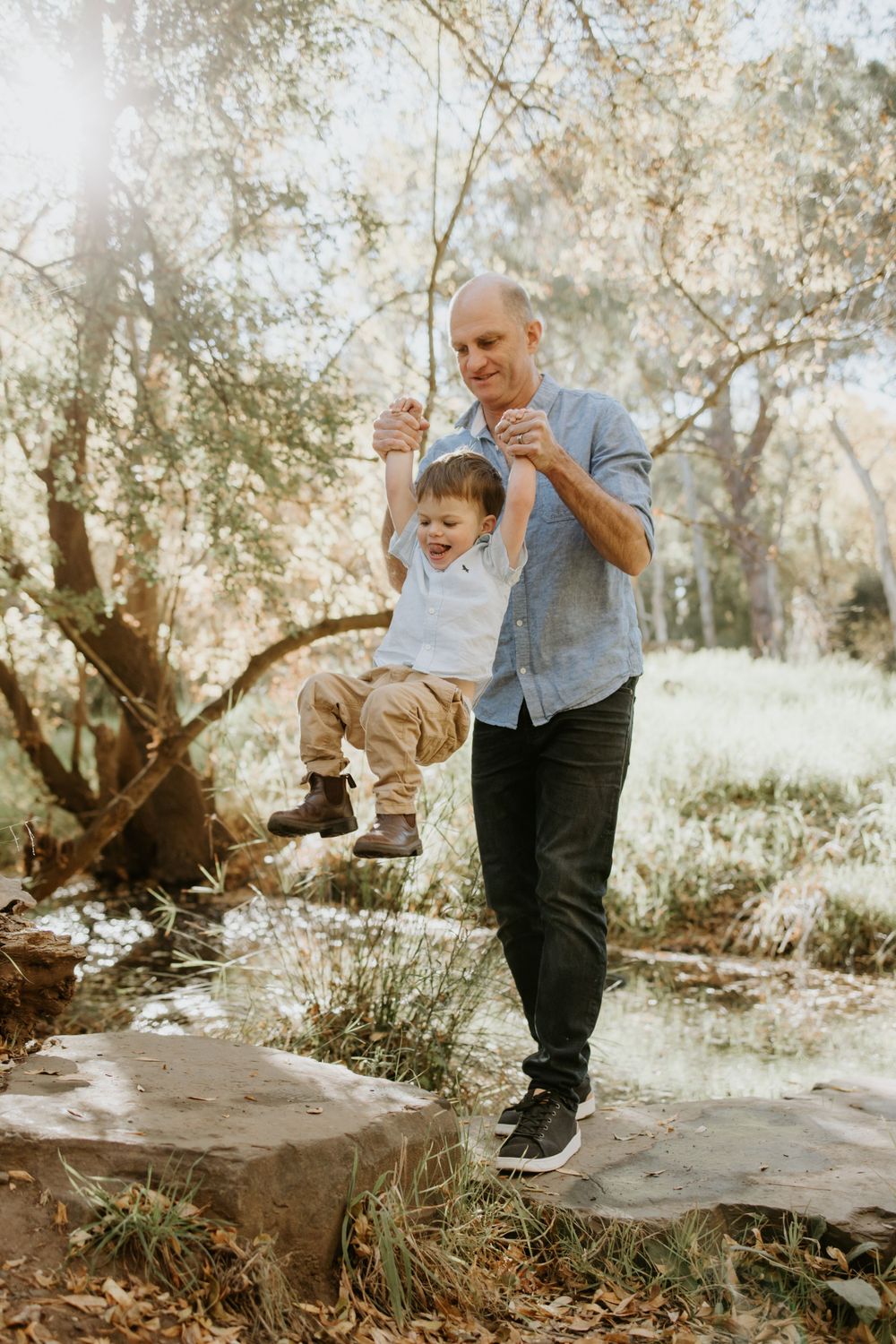 Adelaide family photographer - father and son photography session crossing a creek