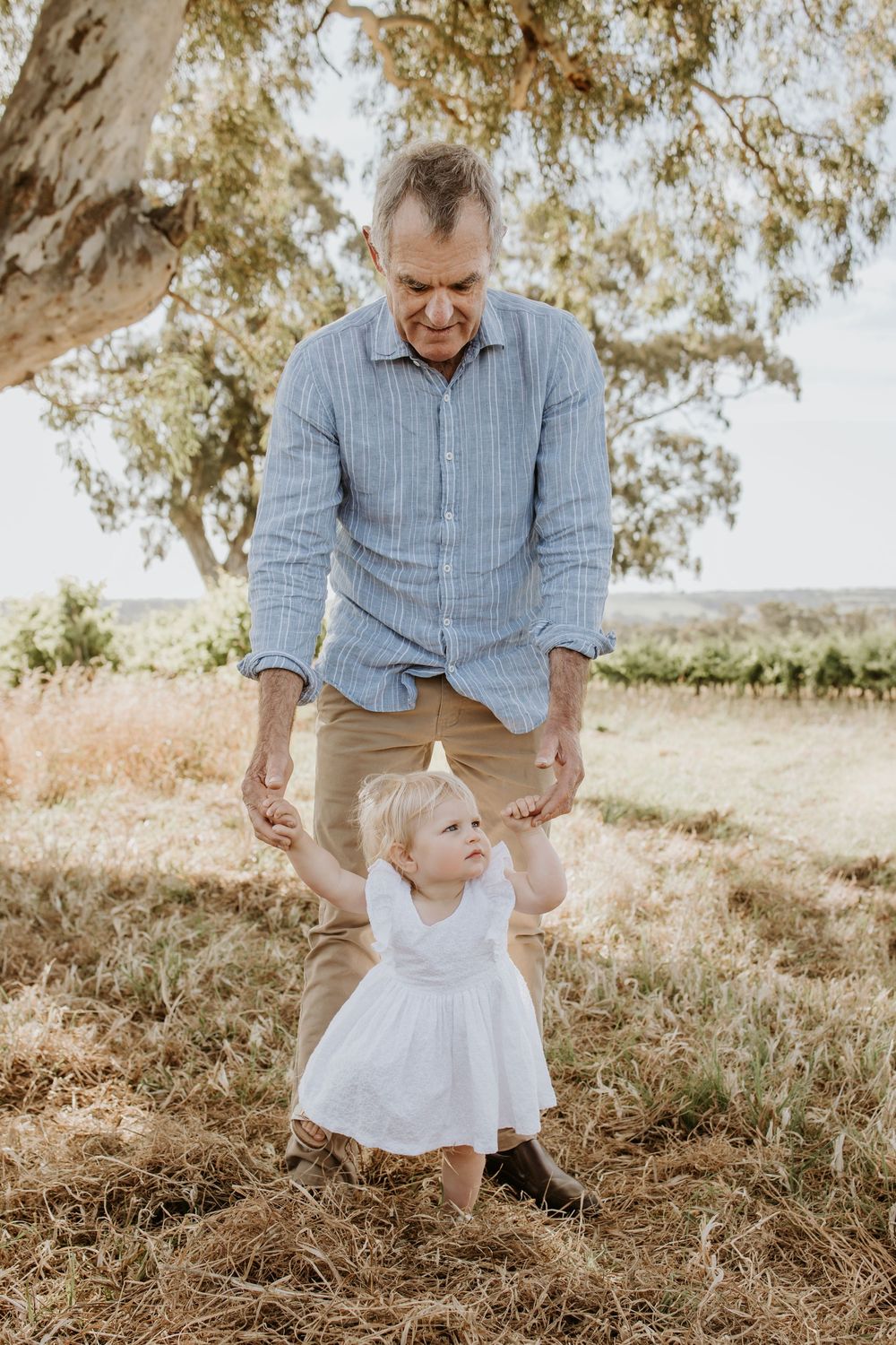 Adelaide family photographer - grandfather with granddaughter in a vineyard