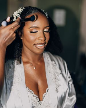 A close-up getting ready scene showing joyful moments during wedding preparations.