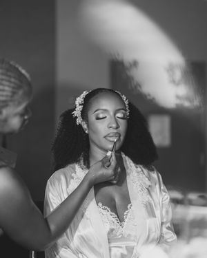 Preparation for a wedding ceremony shown in black and white photos featuring candid getting ready moments.