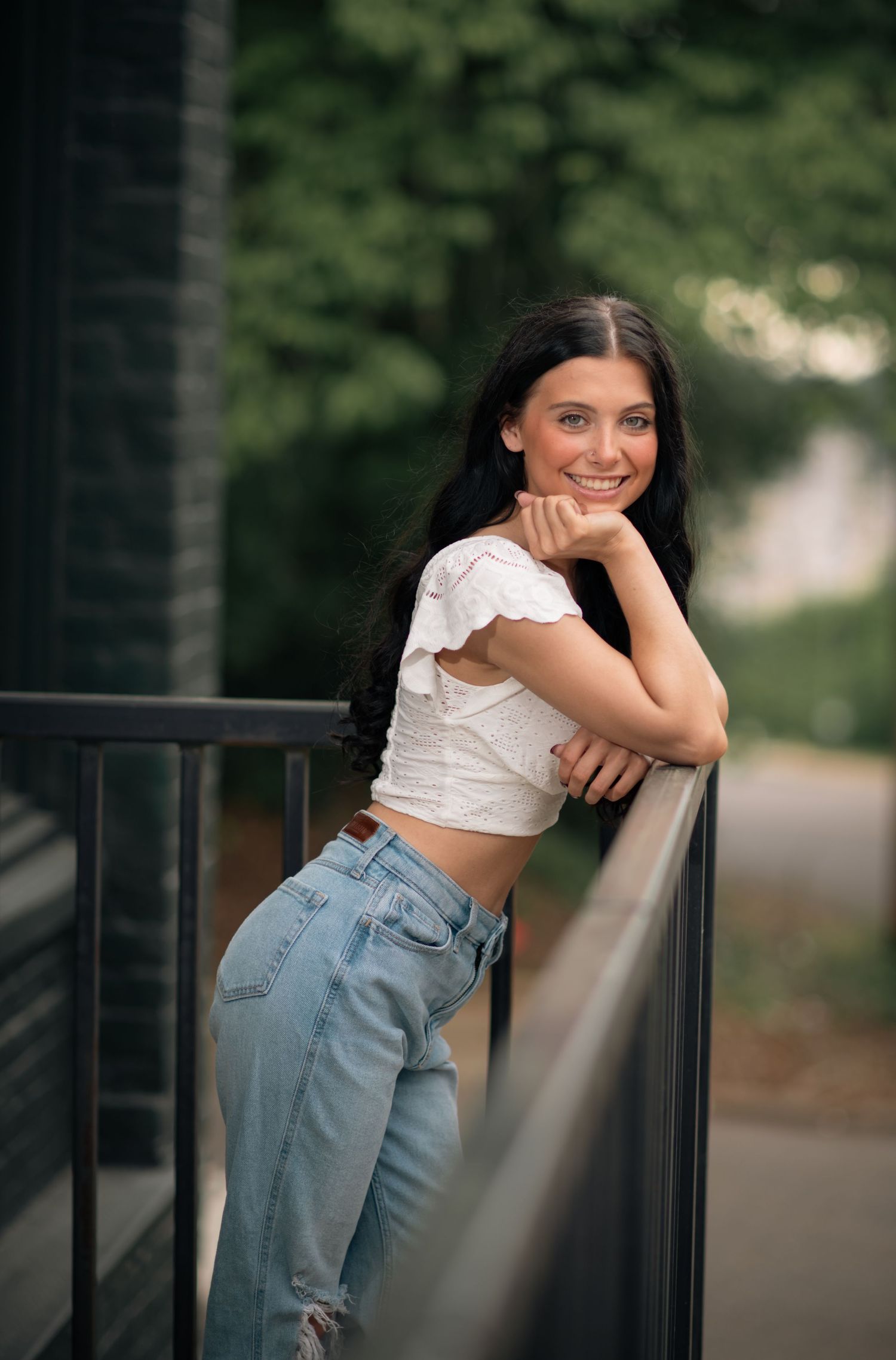 Girl resting on a fence