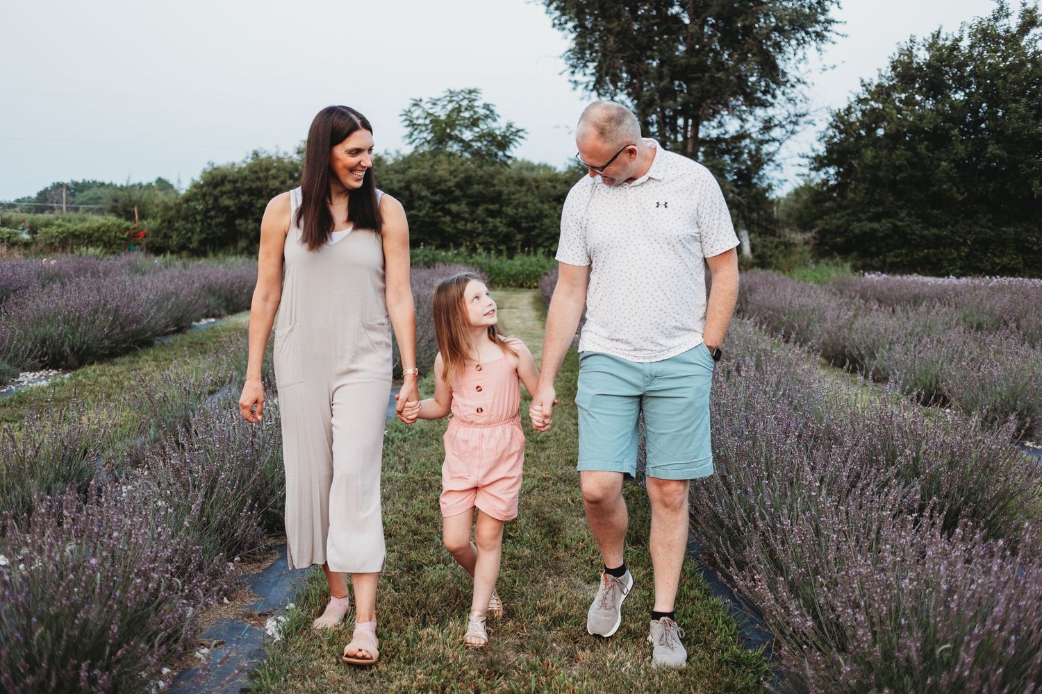 family of 3 at the flower farm in Madrid at Jester Hills Farm