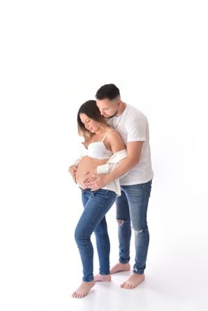 Intimate pregnancy portraits showing tender moments between expectant parents.