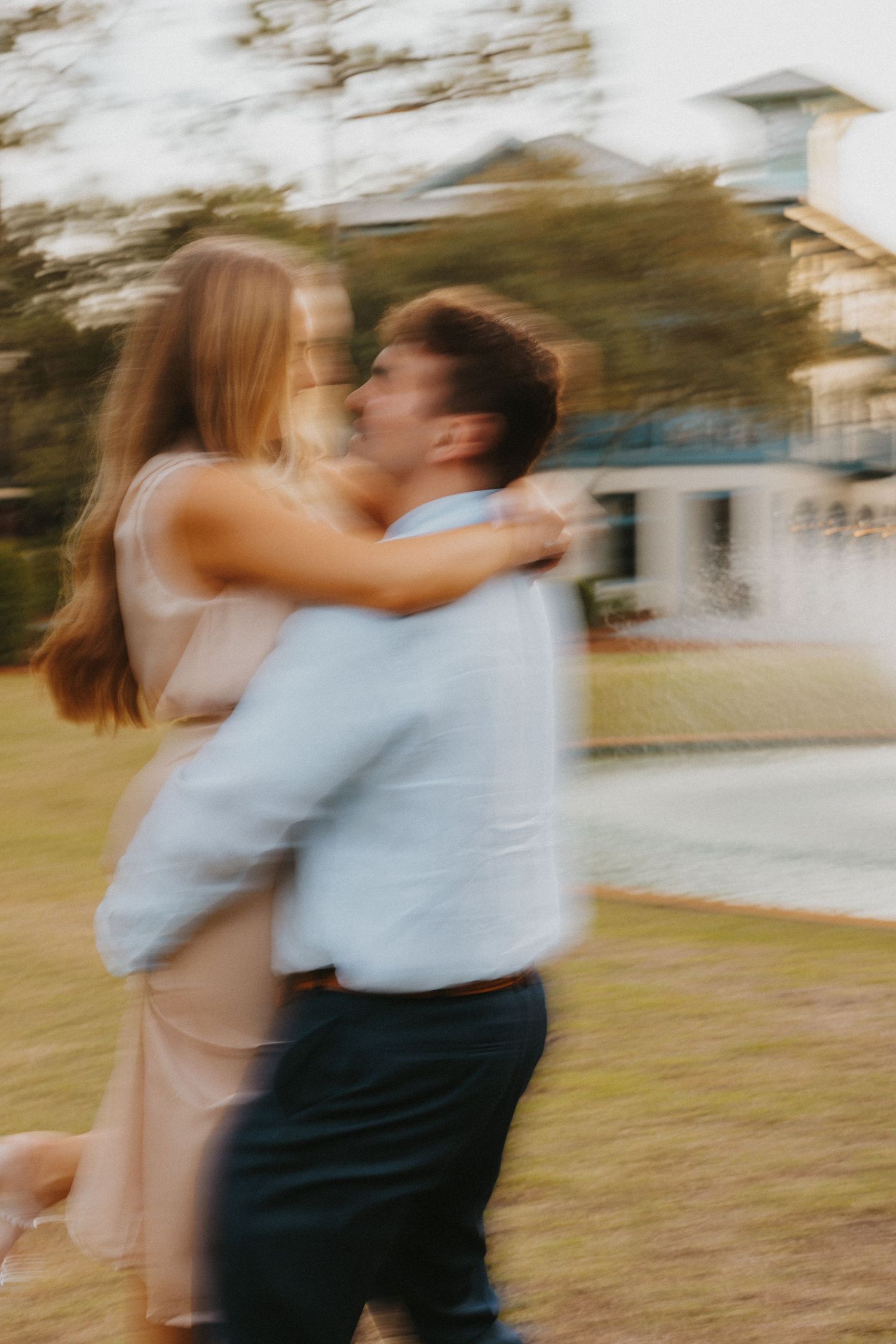 a couple dancing in Cerulean Park for their engagement photos.