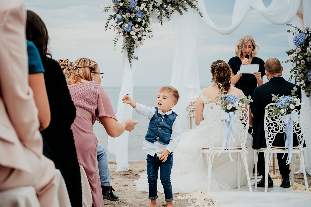 A series of candid wedding reception photos showing guests dancing and celebrating at an indoor venue.
