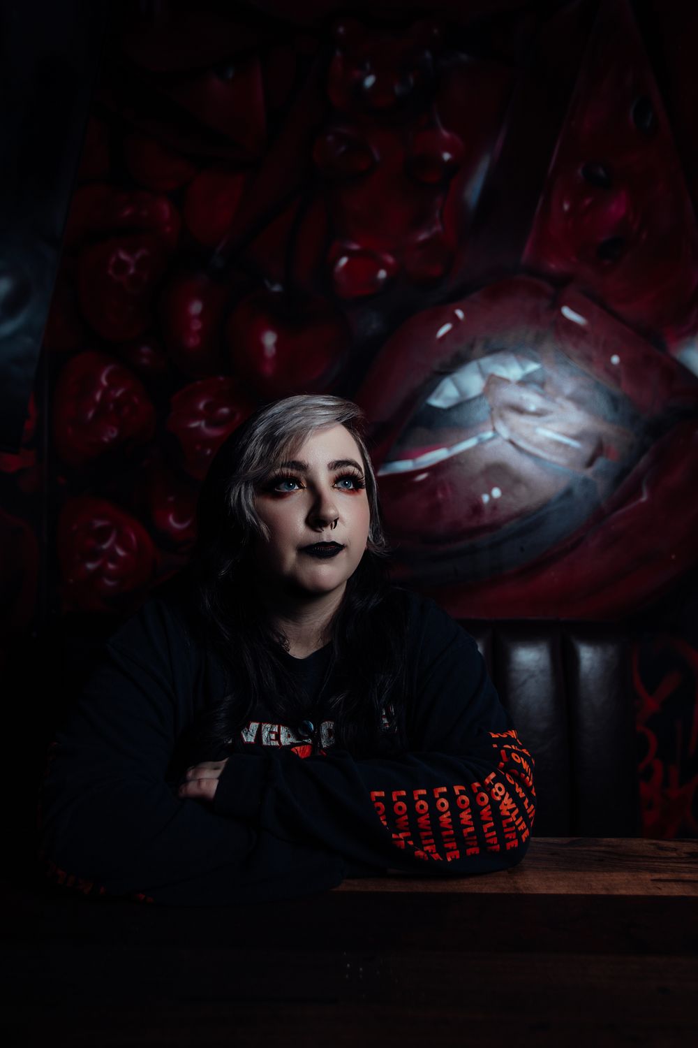 Dark and atmospheric portraits with red lighting creating a gothic aesthetic.