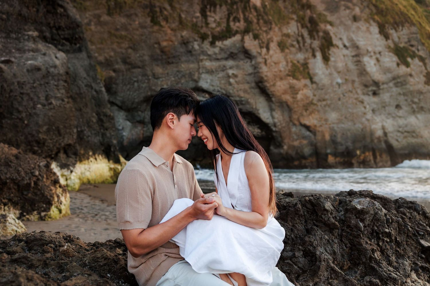 Cute couple having an intimate moment at the beach.