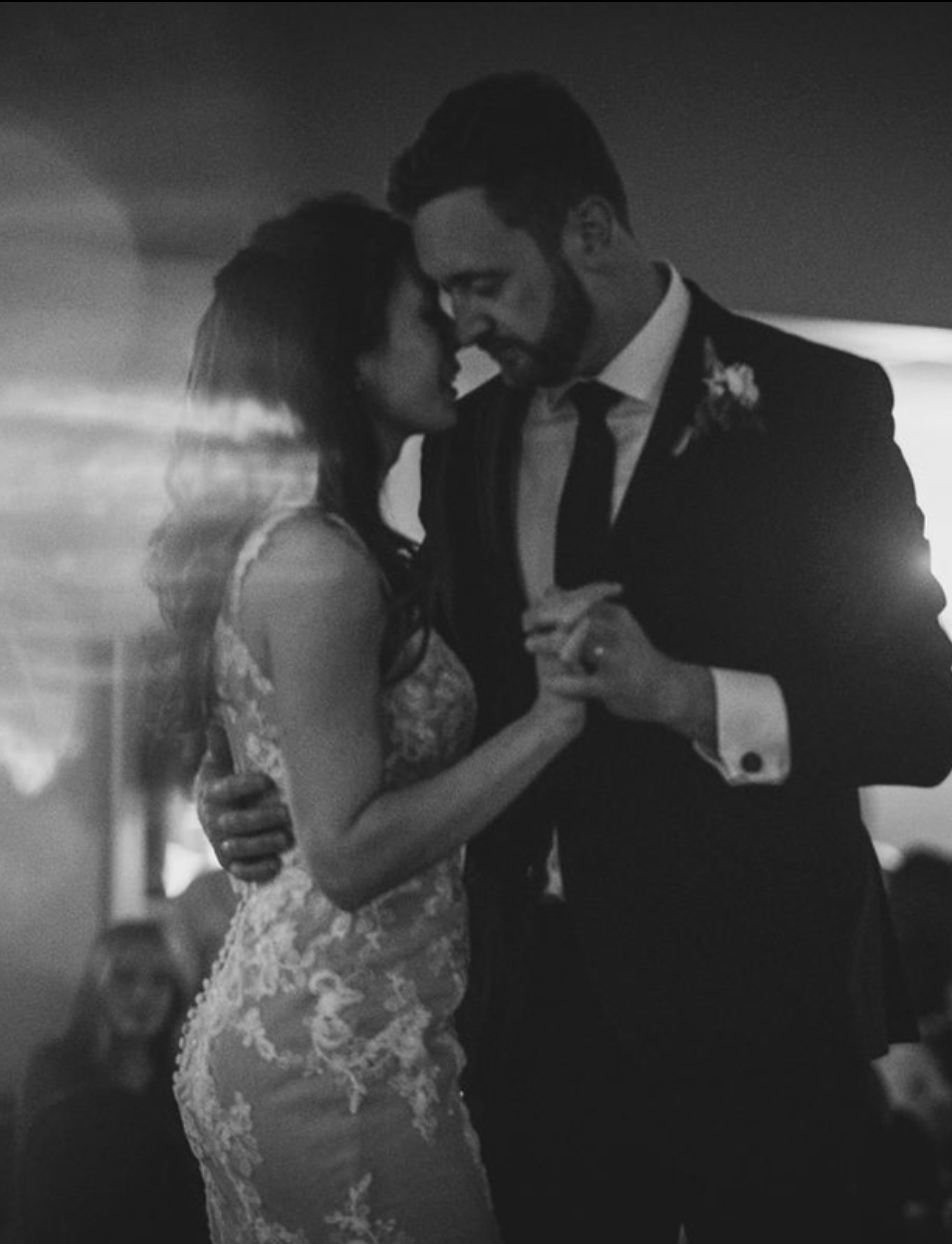 Cinematic dancing photo of a bride and groom.