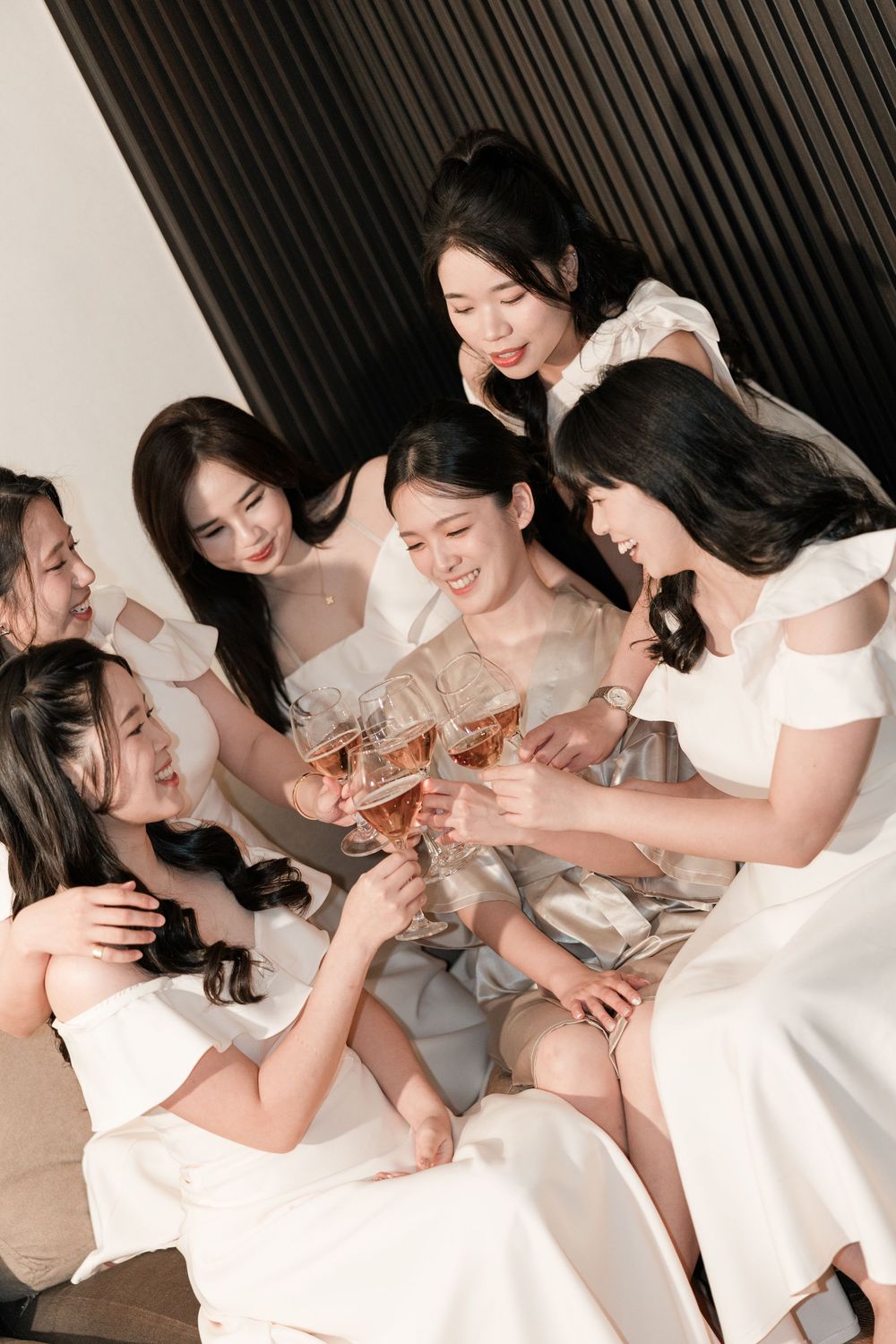 Bride putting on wedding dress during Sibu home wedding preparation