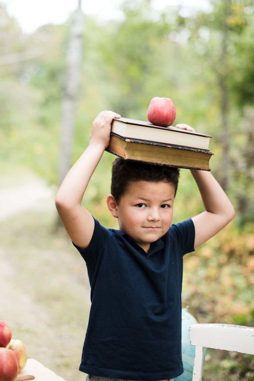 back to school, books on head, photos by Jenni Doerksen