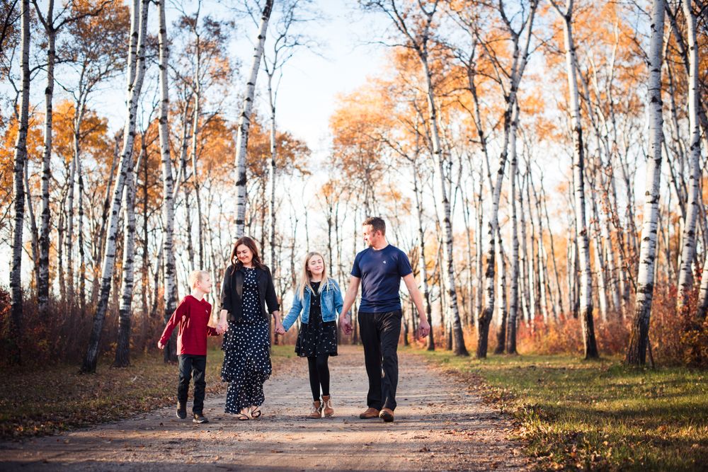 Family photo in fall with poplar trees
