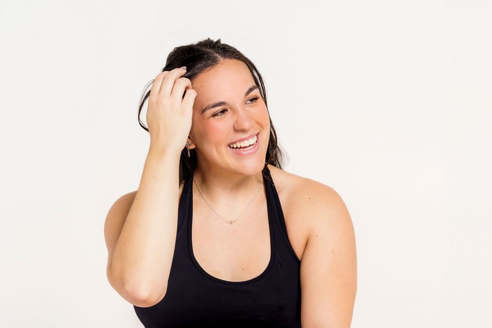 A fitness photoshoot shows athletic poses in a casual tank top against a white background.