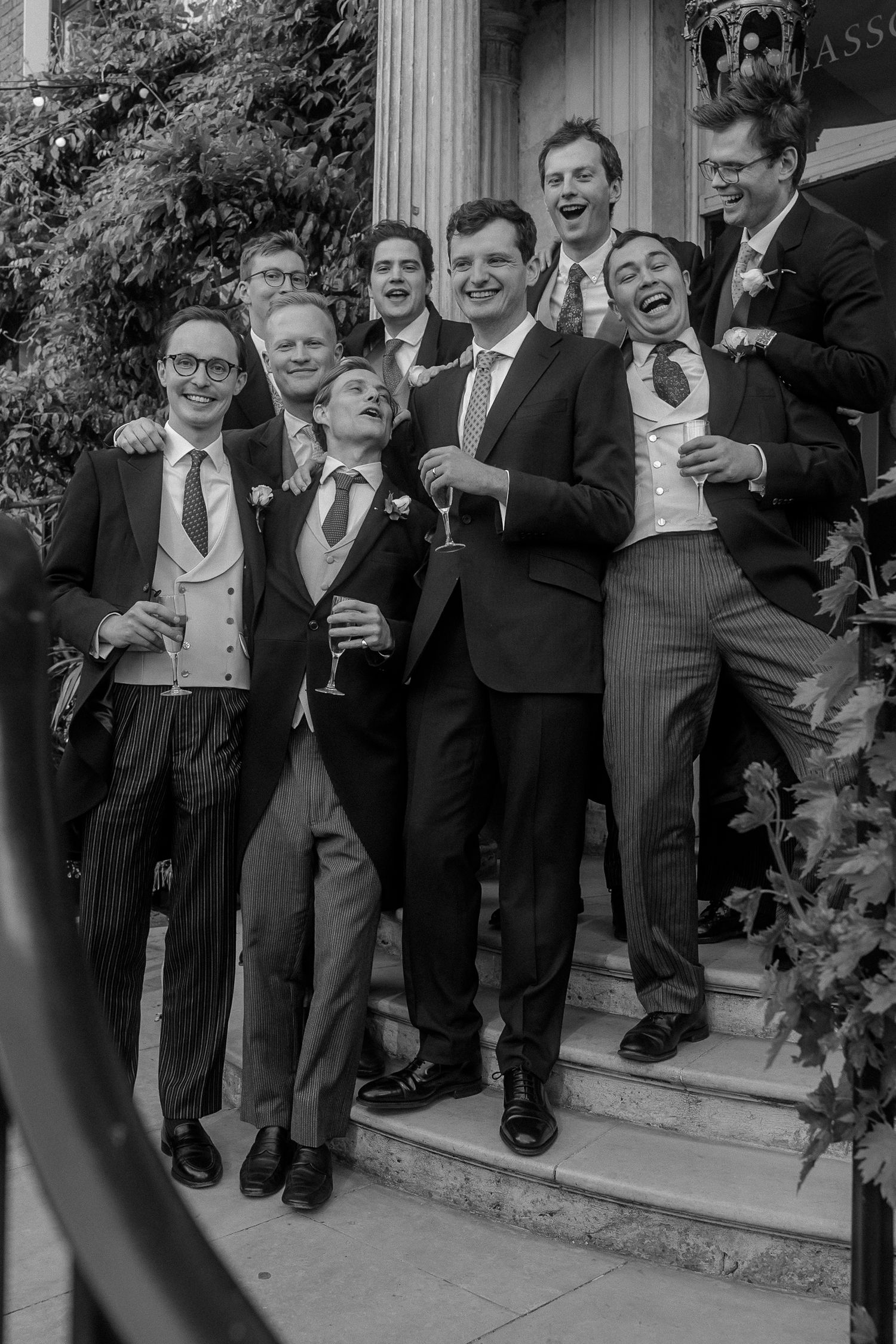 group of groomsmen on the front steps Brunswick house
