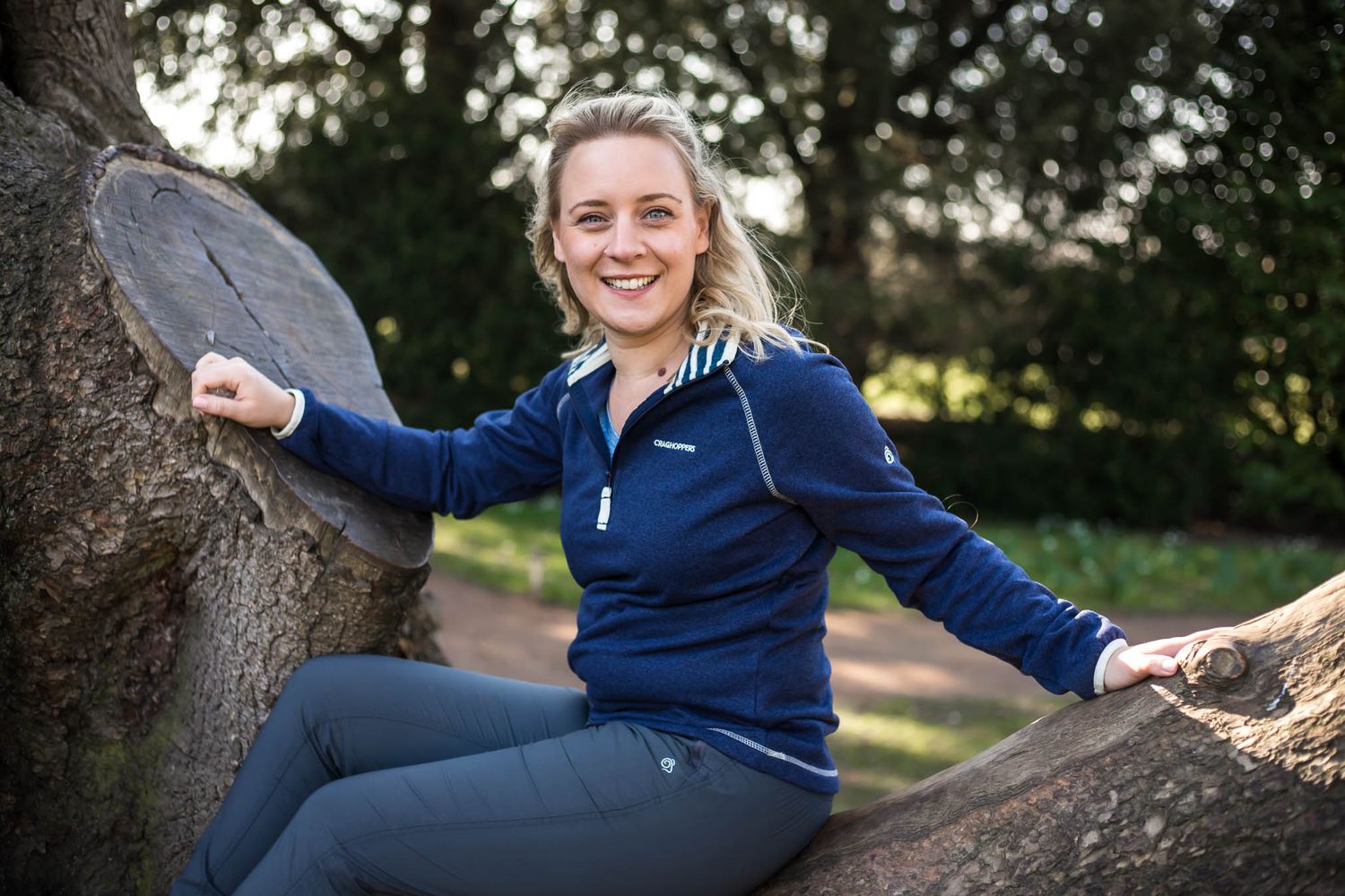 Holly Hancocks, Redditch photographer, sat in a tree looking at the camera