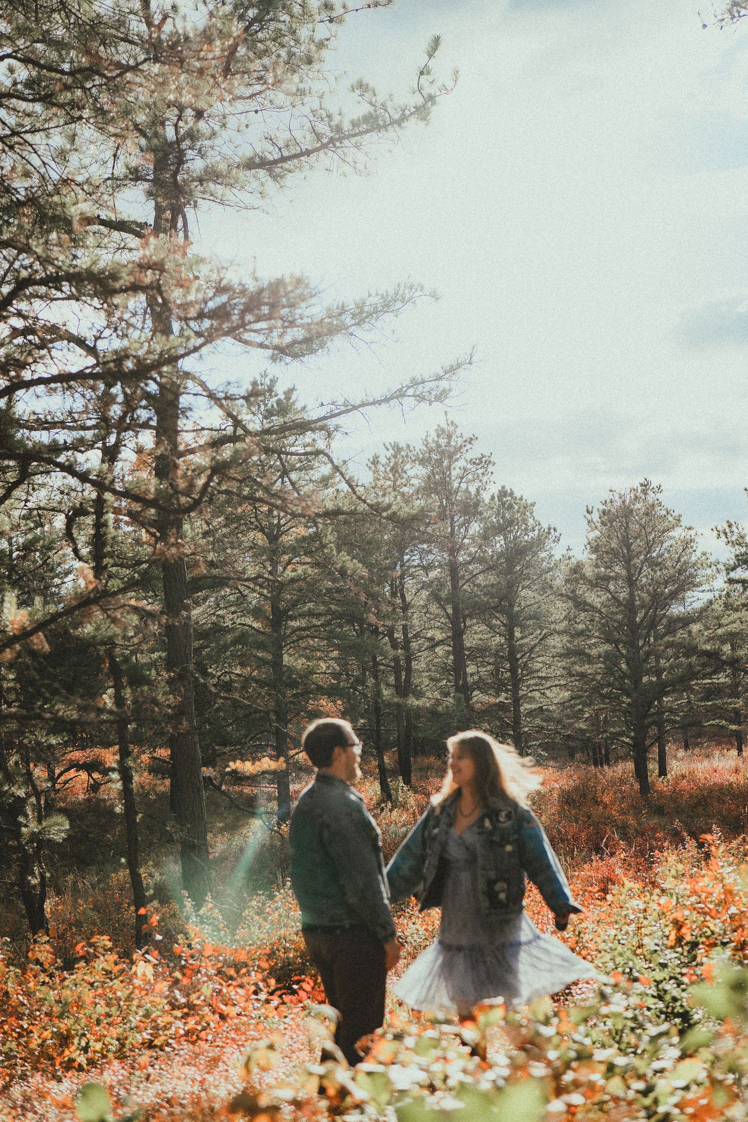 guy and girl with ring engagement photography