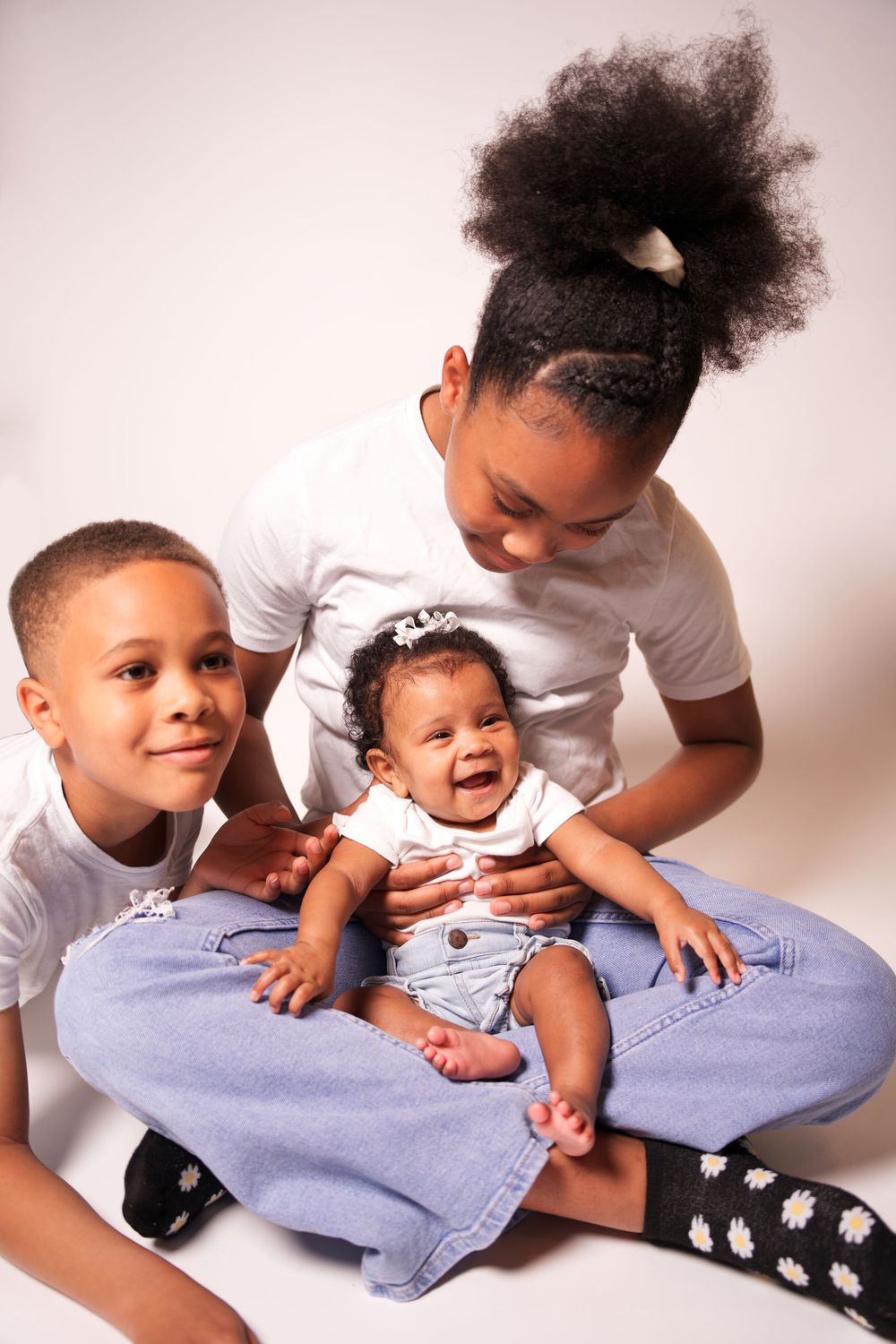 Playful family moments captured during a professional photoshoot in Griffin, GA.