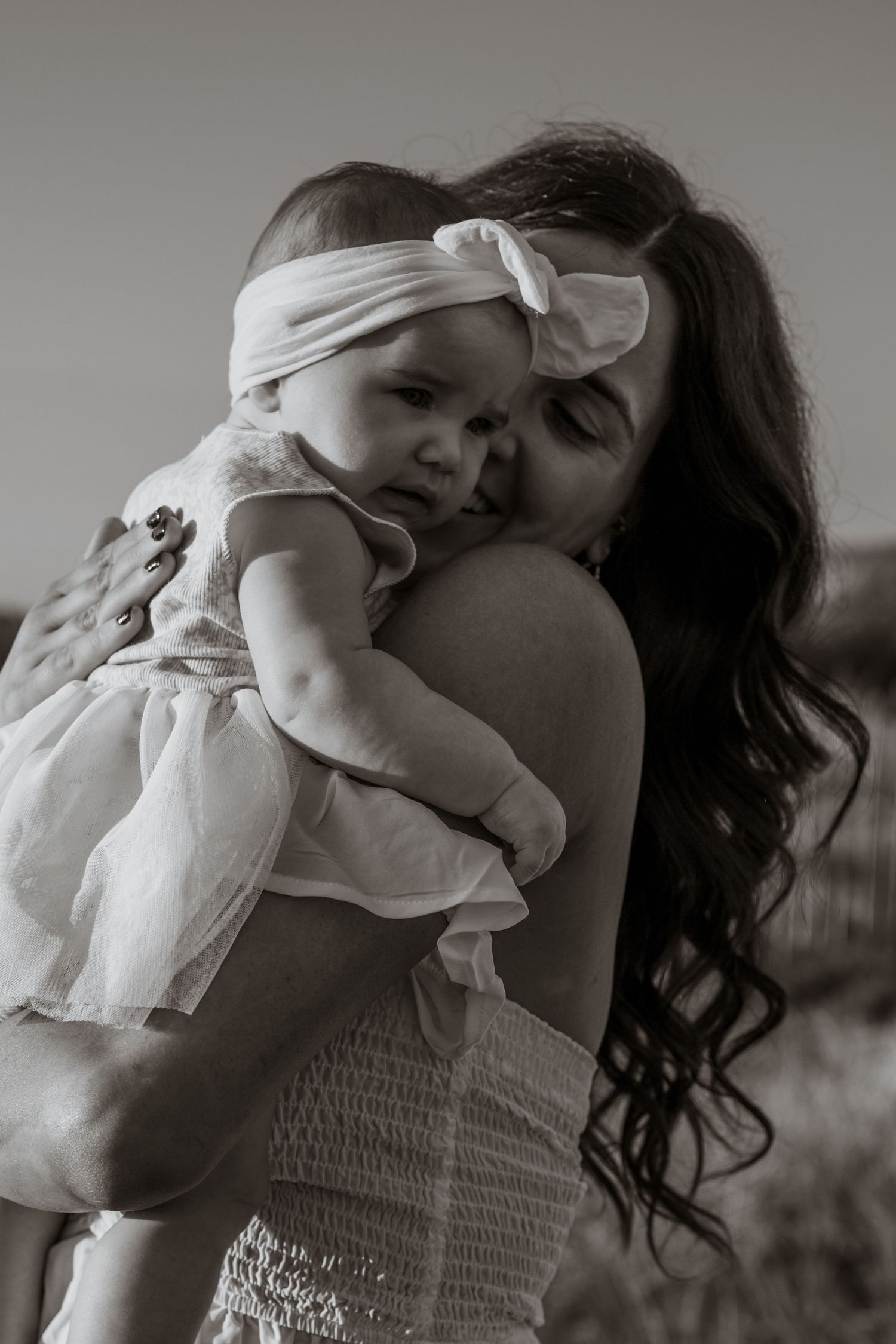 Series of tender black and white moments showing affectionate embraces.