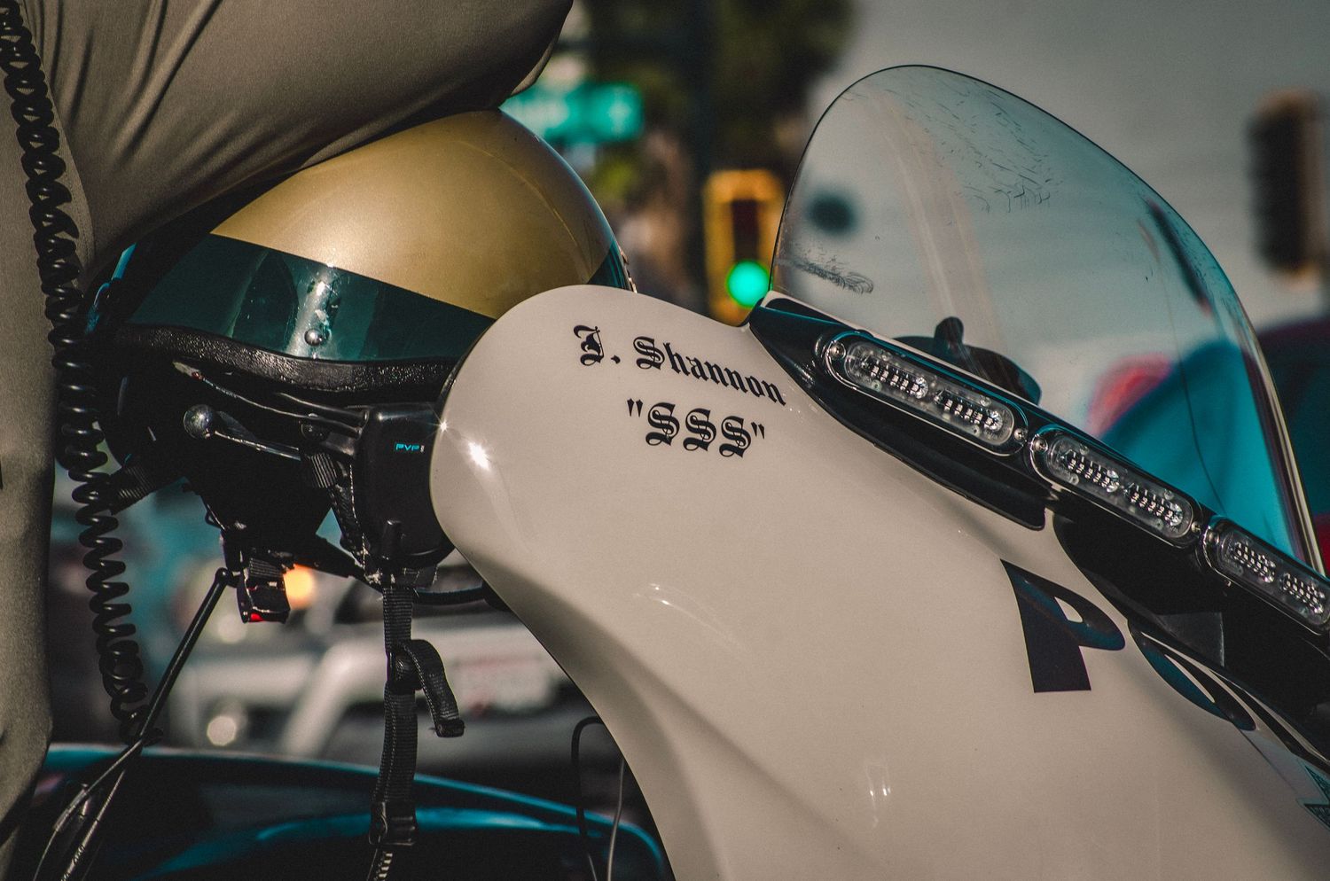 Close-up detail of a modern motorcycle's handlebar and windscreen.