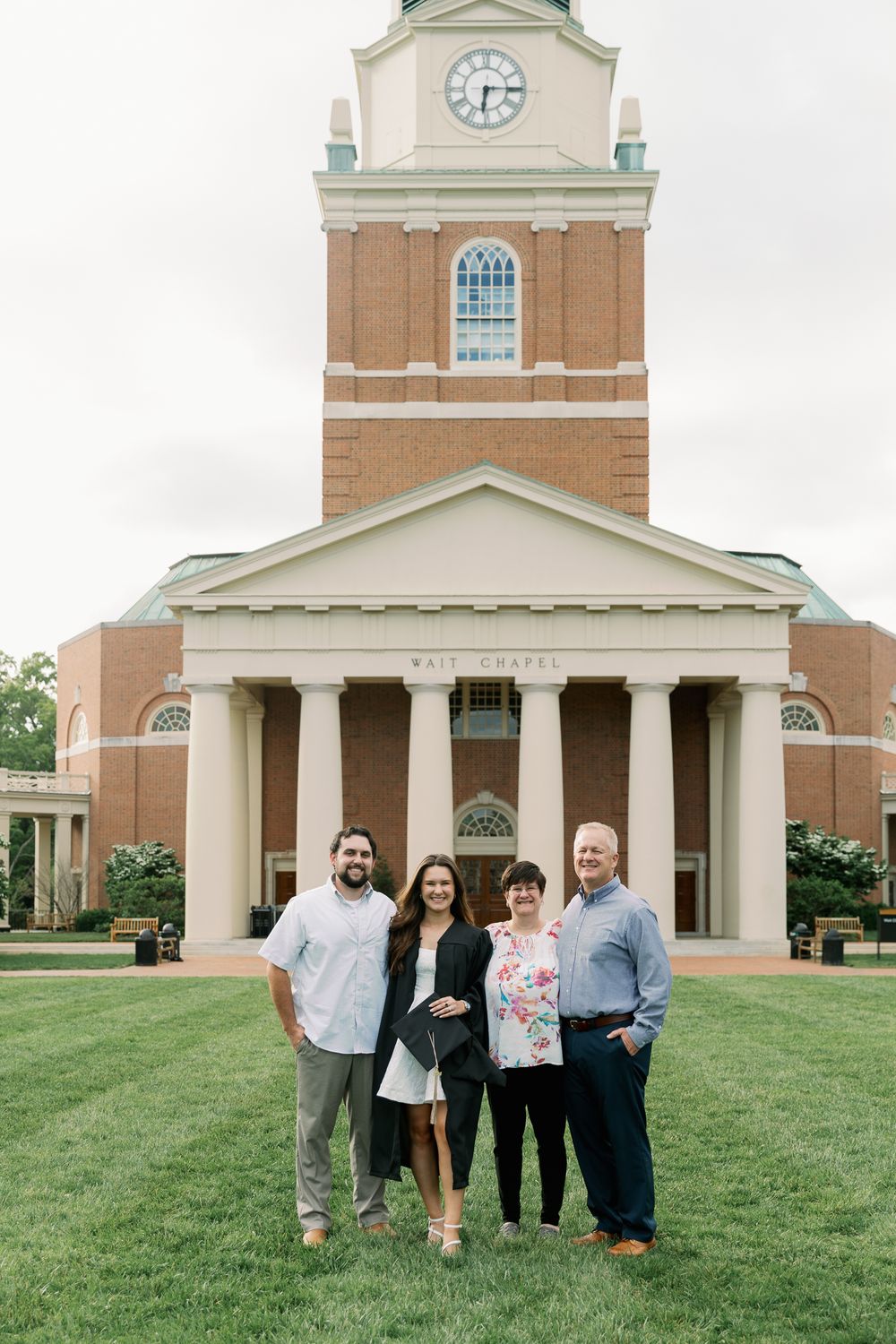 Group photo in front of Wait Chapel's iconic clock tower and columns.