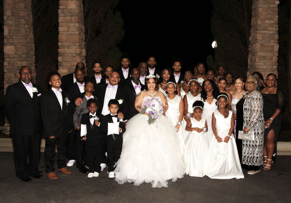 Bridal party group photo with matching dresses and bouquets