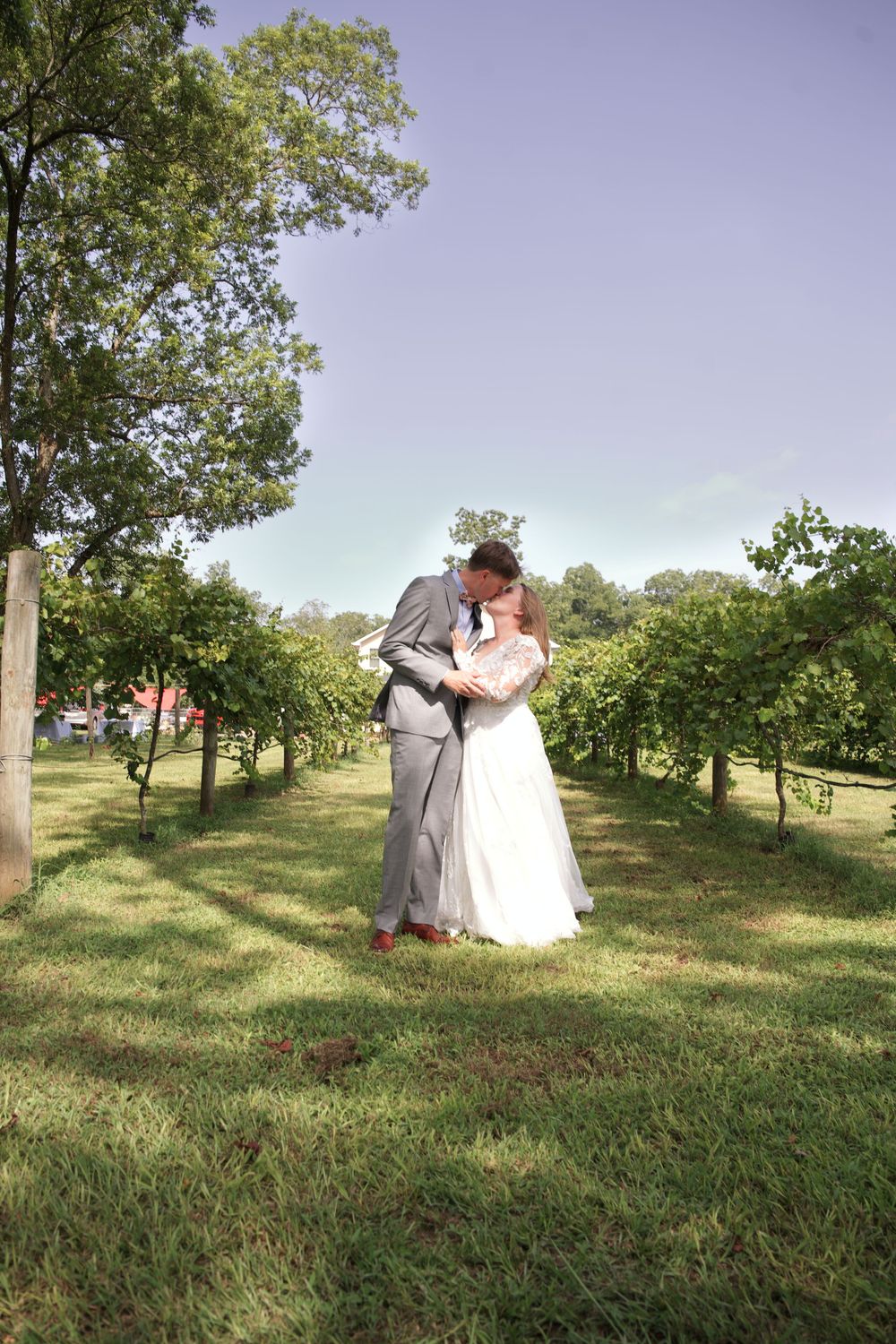 Bride in white dress and groom sharing a kiss in Griffin, Georgia