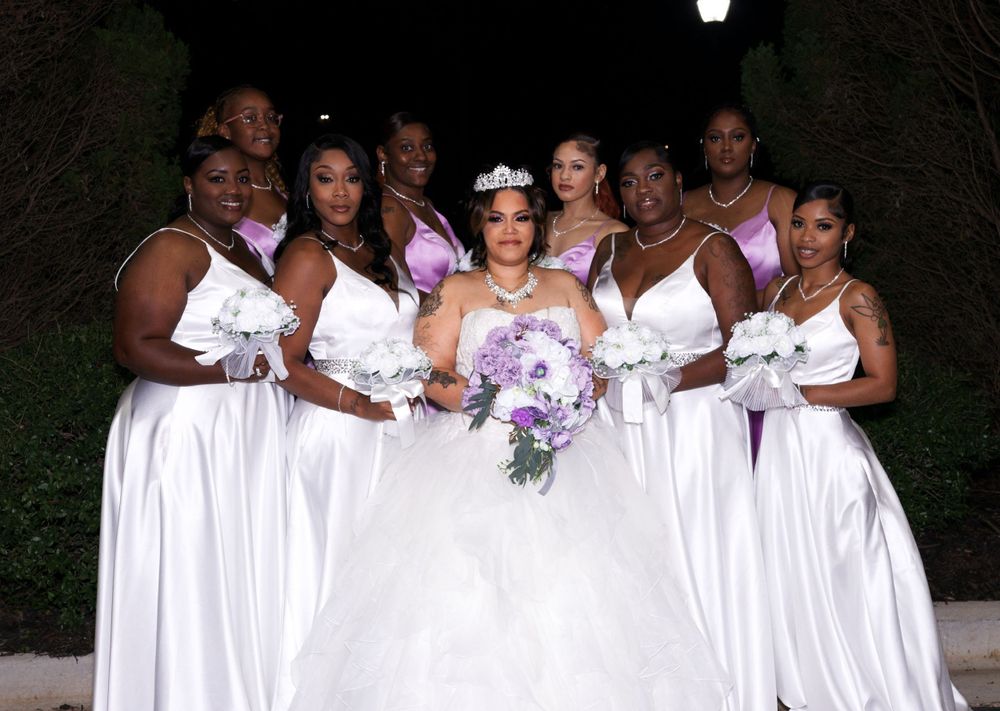 Bridal party group photo with matching dresses and bouquets