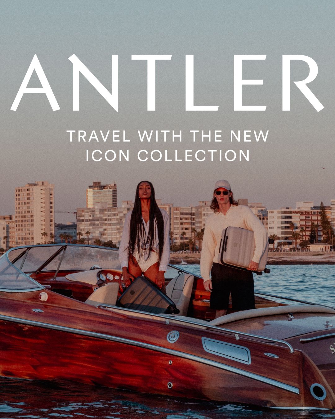 Antler luggage campaign showcasing people on a vintage boat in an urban harbor setting.