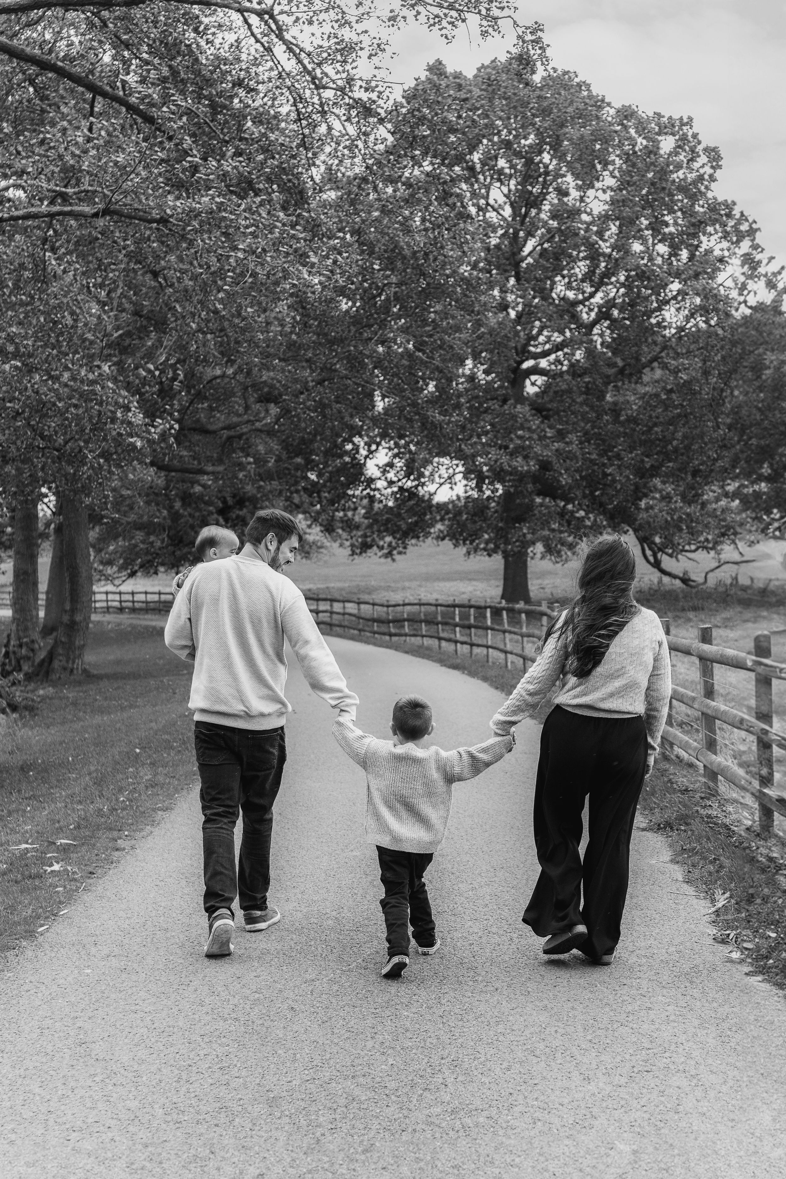 Outdoor family photographer Derby natural family photos  holding hands park session