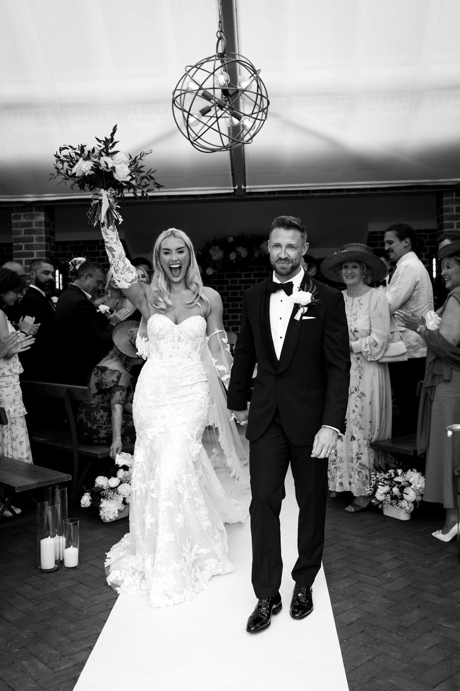 A bride and groom celebrate after getting married at syrencot