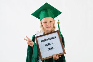 Three photos show a graduate in green cap and gown holding different signs showing kindergarten graduation milestones.