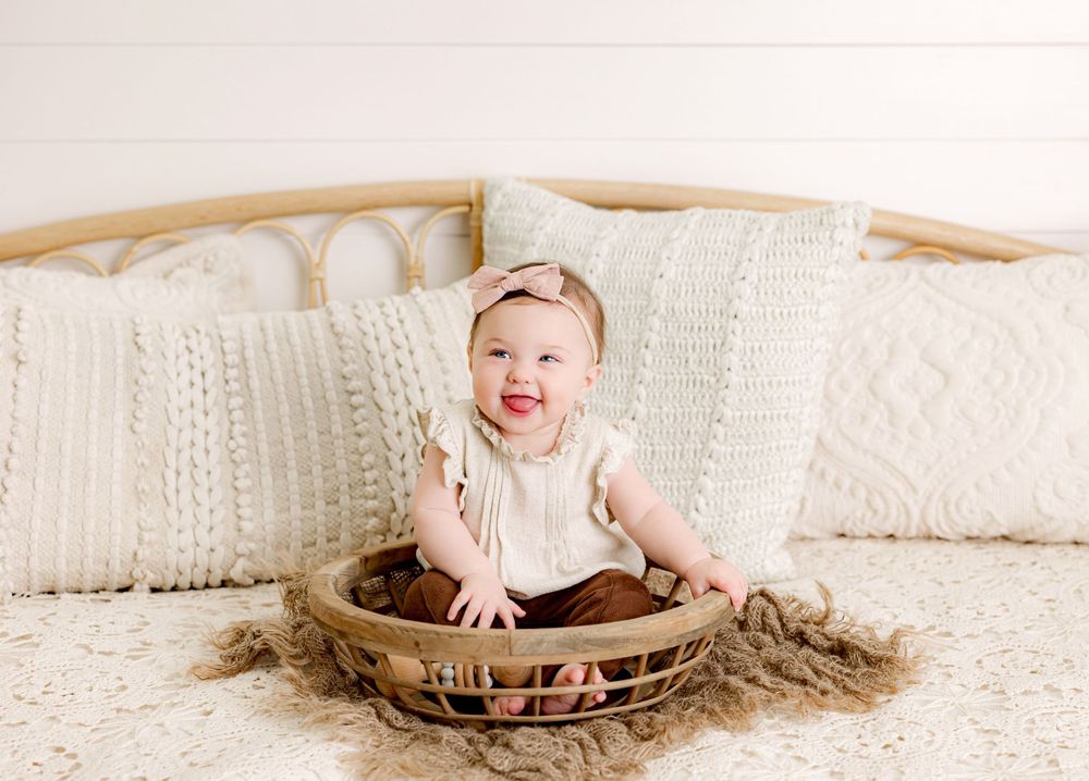 Baby photography session with cream colored knit blankets and rustic props. Six month milestone. Middle TN baby photographer.