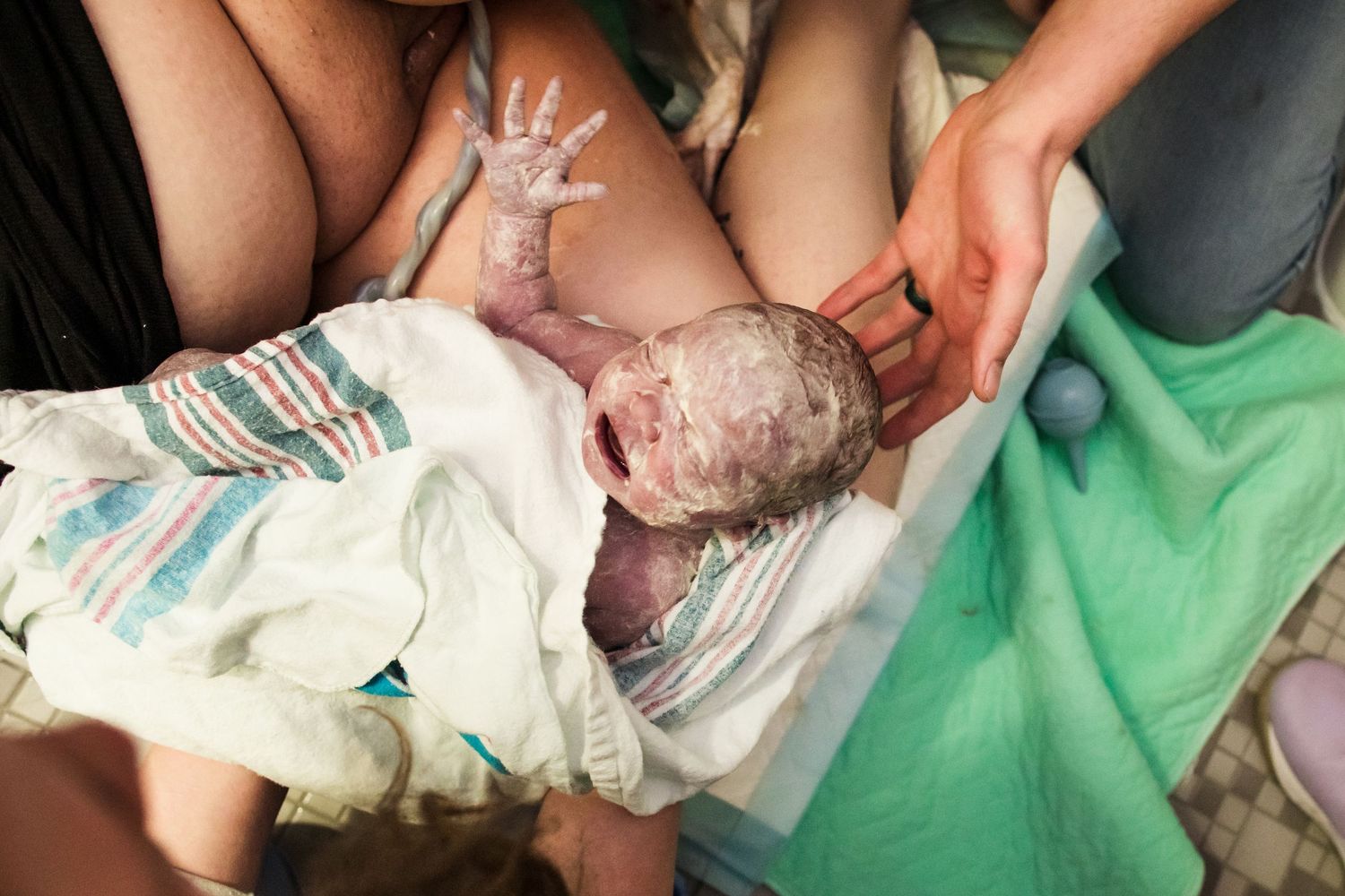 newborn on mother's chest