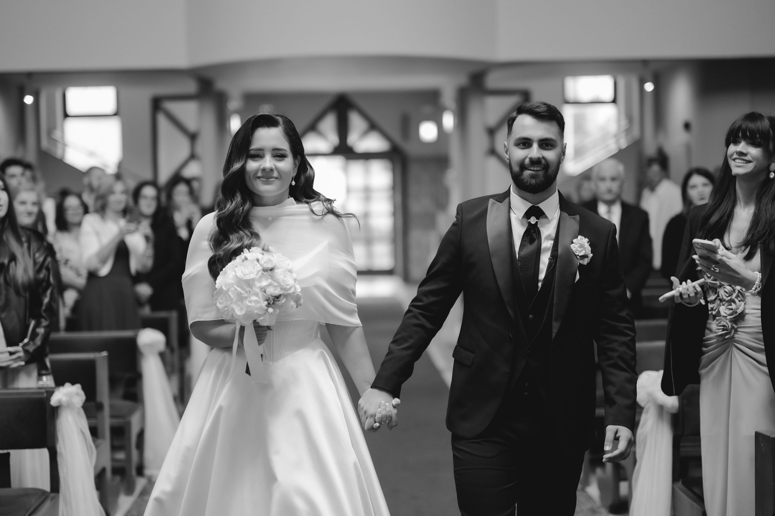 A collection of black and white wedding photographs showing couples and guests celebrating at a reception.
