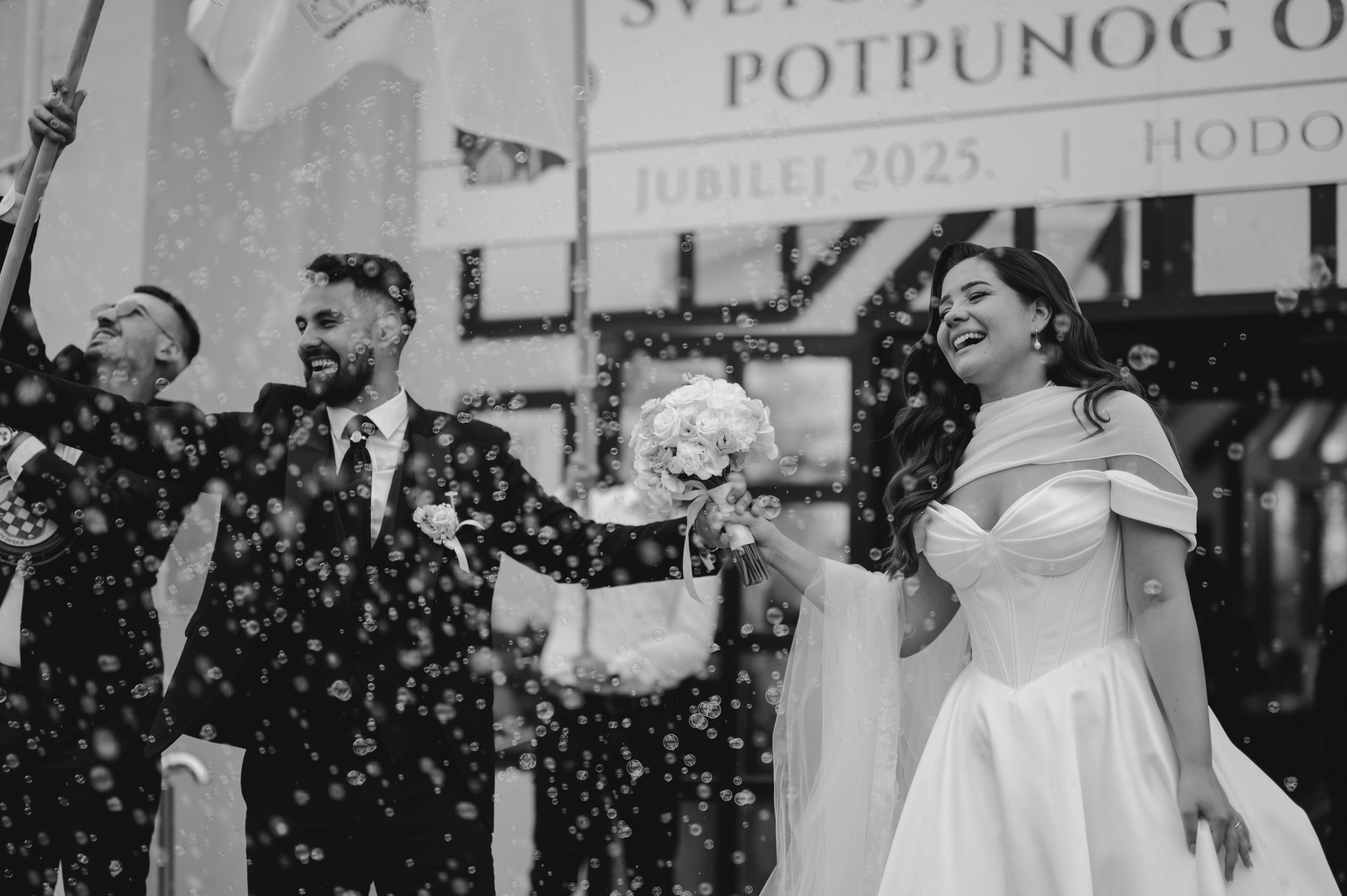 A series of black and white wedding photographs showing joyful moments and celebrations.