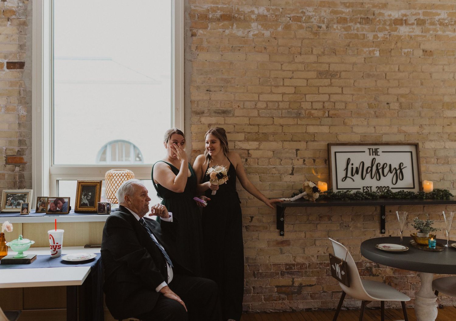 Wedding venue interior featuring exposed brick walls and vintage-style decor.