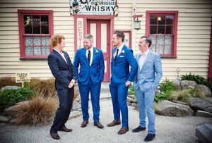 The groomsmen posing outside The Cardona Hotel