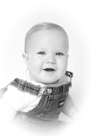 Close-up black and white portraits of baby wearing denim and white clothing.
