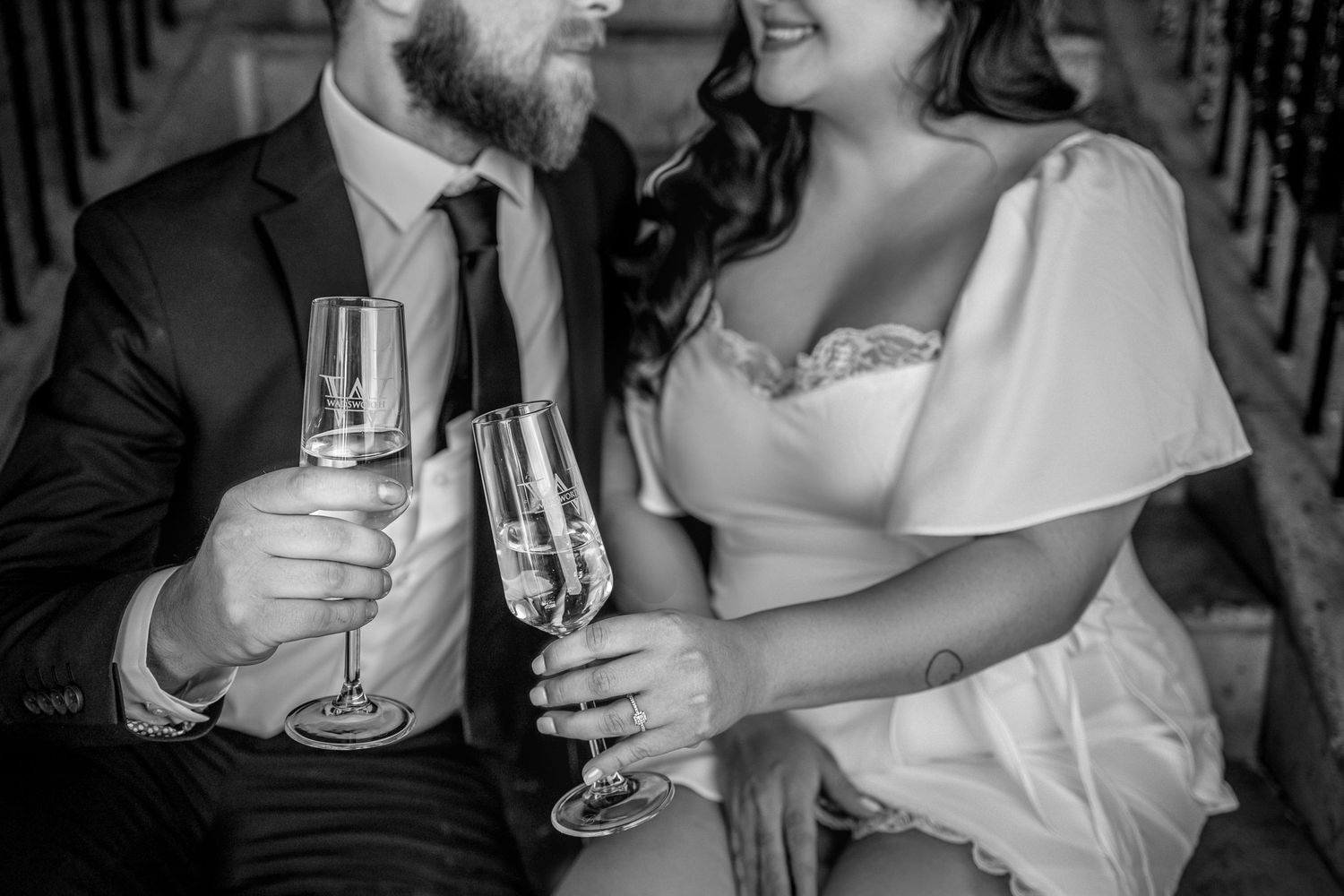 People hold and toast with champagne glasses at an elegant celebration event.