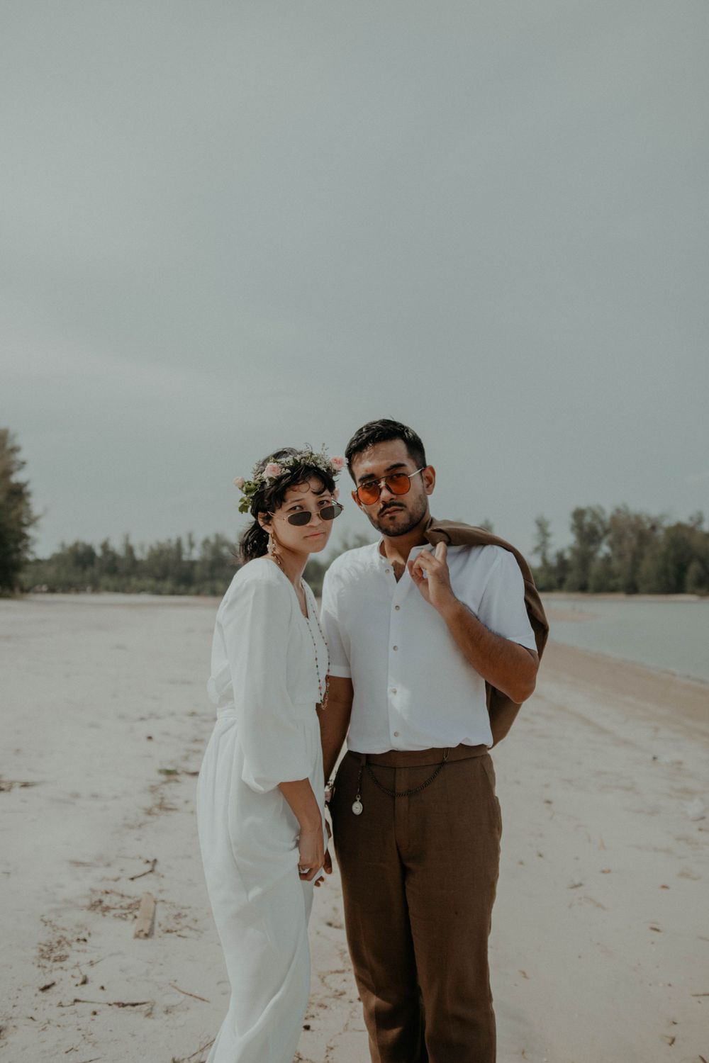 Malay couple posing for portrait session after the wedding at Balok beach, Pahang