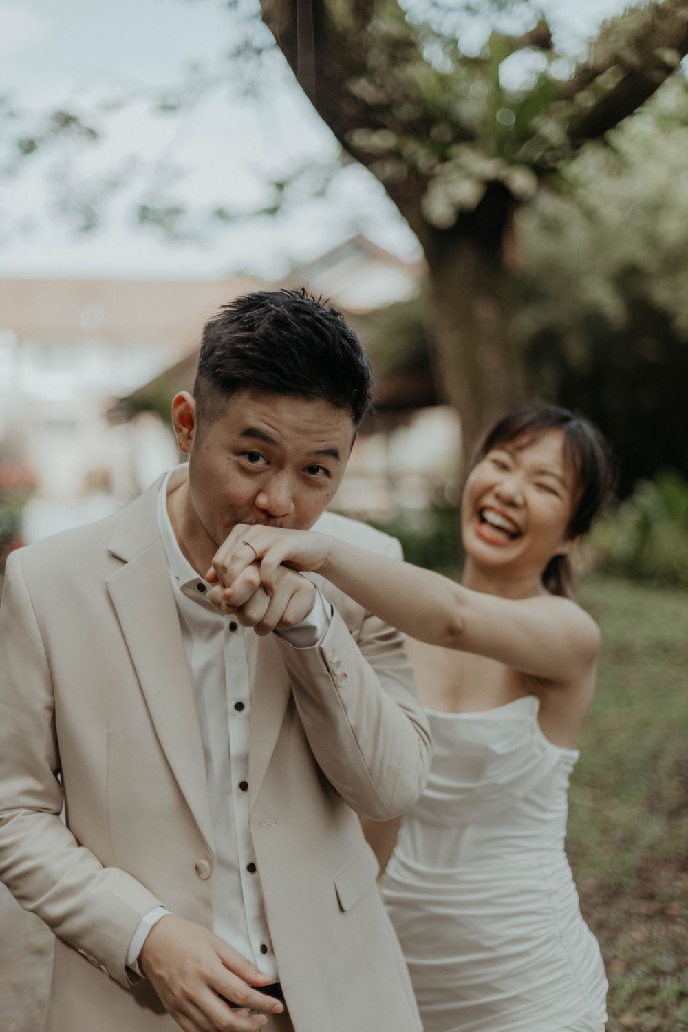 Groom kissing bride's hand during pre-wedding photography in Kuala Lumpur, Malaysia