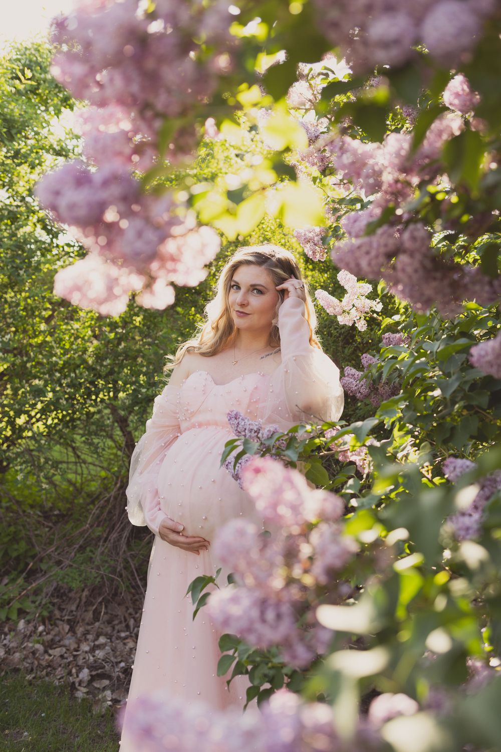 Outdoor maternity photos in lilacs, taken by Jen Knightstep, Photographer