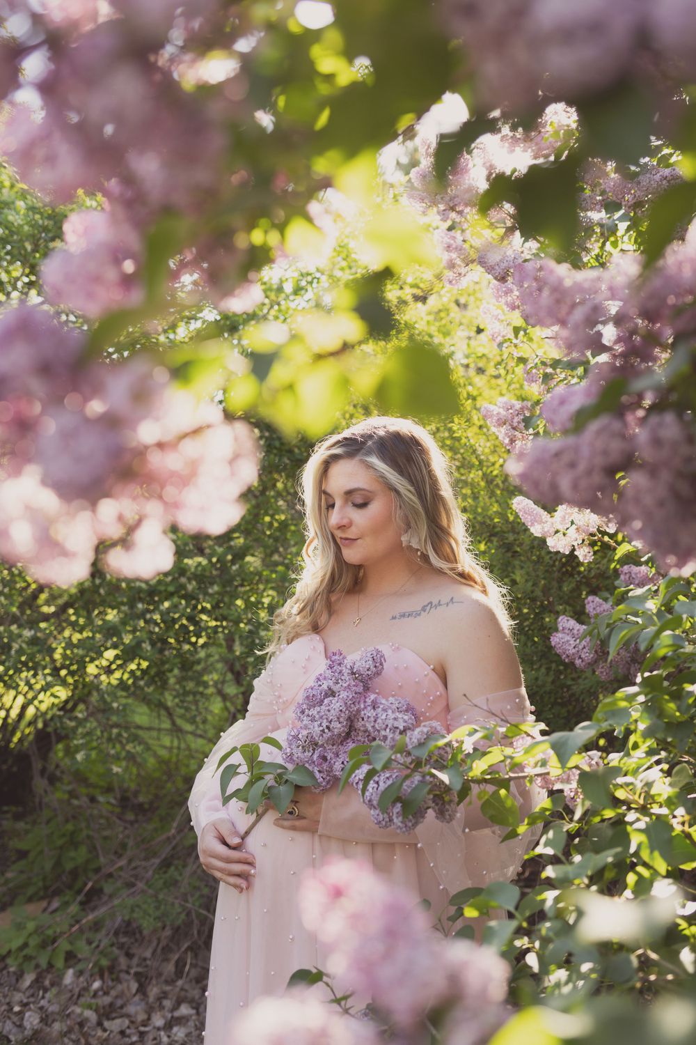 Outdoor maternity photos in lilacs, taken by Jen Knightstep, Photographer