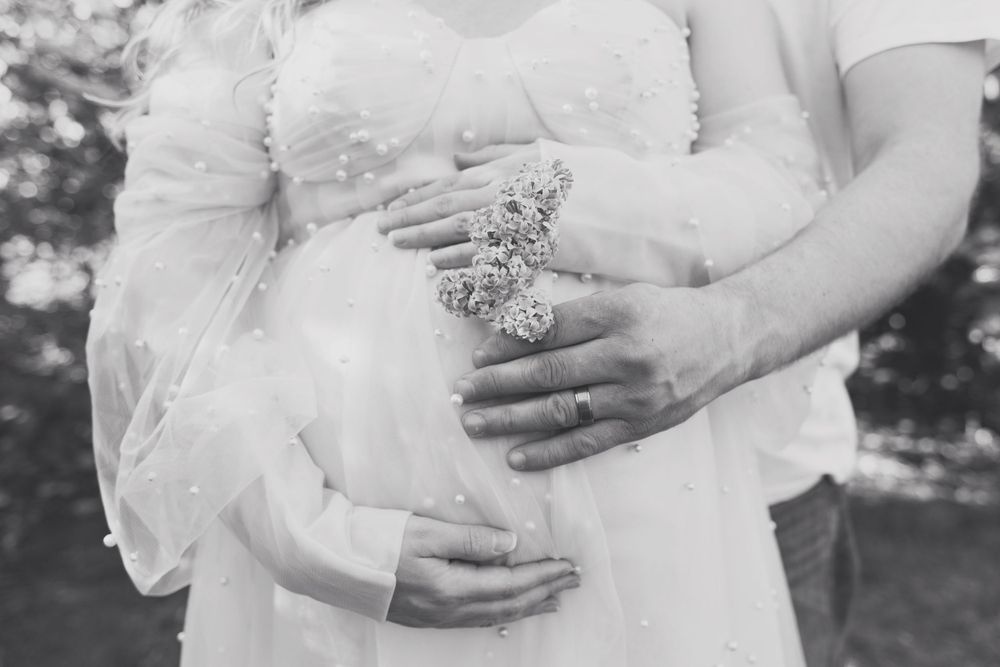 Outdoor maternity photos in lilacs, taken by Jen Knightstep, Photographer