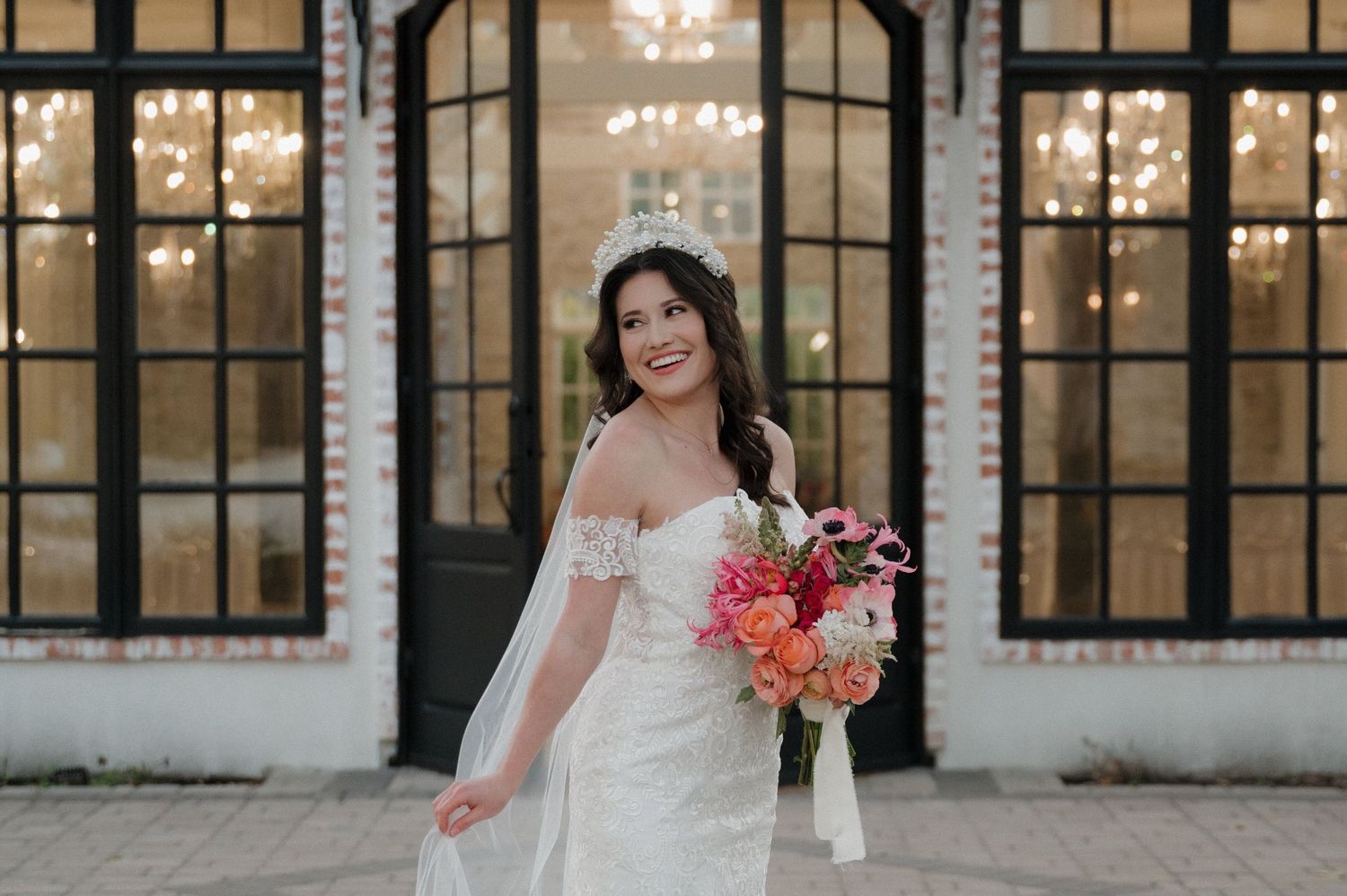 Bride posing for portraits in front of the chapel at The Peach Orchard wedding venue.
