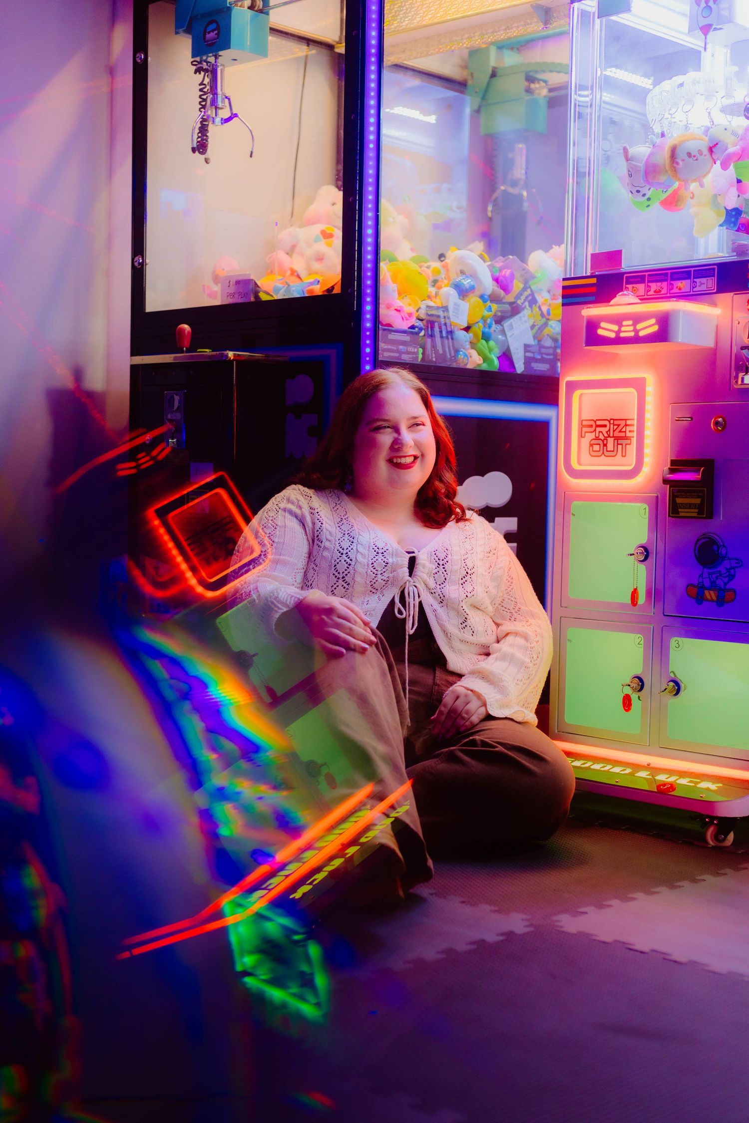 A colorful neon-lit room with arcade games and bright LED lighting effects.