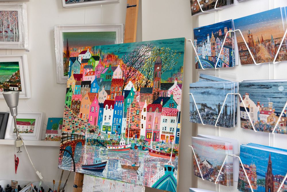 Artwork and postcards of art in an artist studio