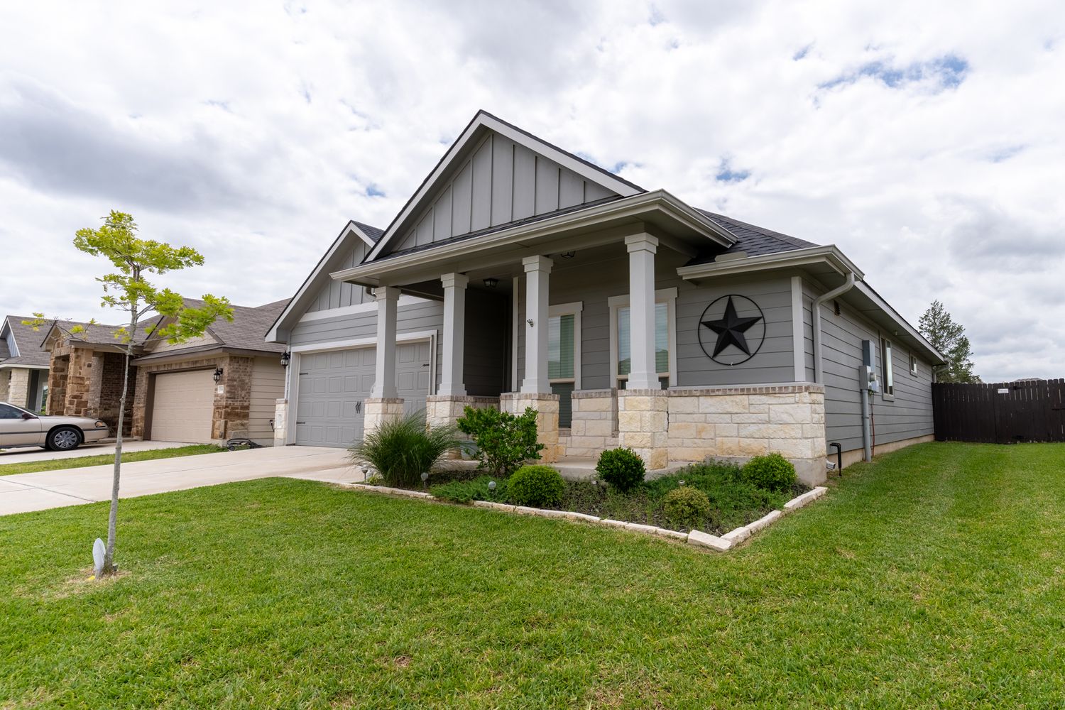 Ranch-style home exterior with stone accents and decorative star on the front facade.
