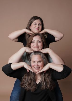 three women laughing heads stacked